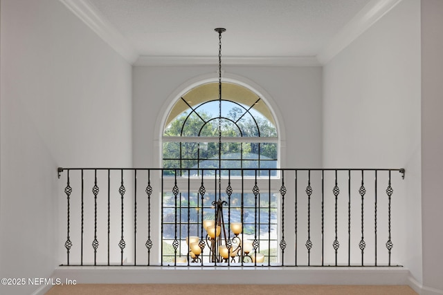 details with a notable chandelier and crown molding