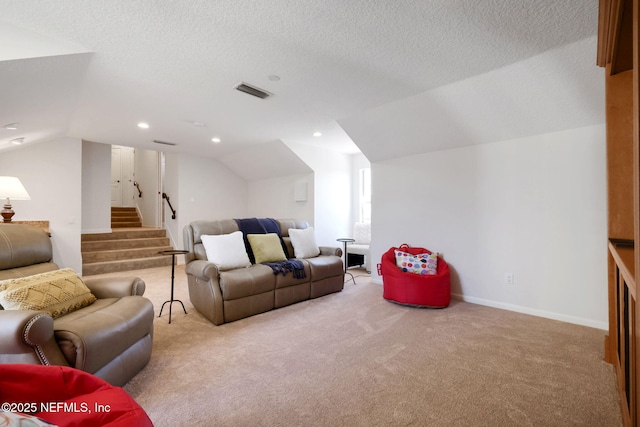 living room with stairway, baseboards, lofted ceiling, a textured ceiling, and carpet flooring