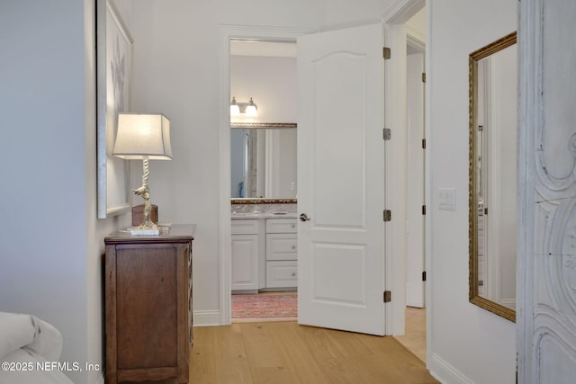 corridor featuring light wood-style floors