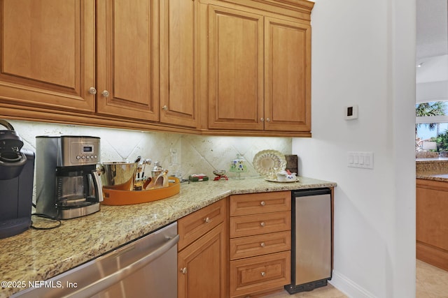 kitchen featuring stainless steel dishwasher, light stone counters, tasteful backsplash, and brown cabinets