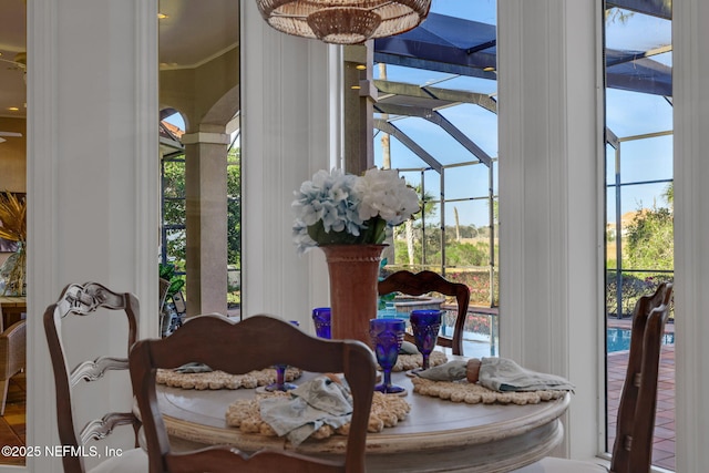 dining area with a healthy amount of sunlight and a sunroom