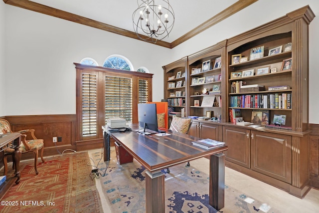 office featuring a wainscoted wall, an inviting chandelier, and ornamental molding