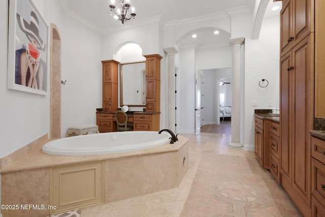 full bathroom featuring ensuite bathroom, a bath, crown molding, and ornate columns