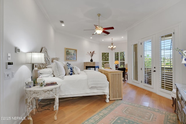 bedroom featuring access to exterior, french doors, visible vents, and ornamental molding