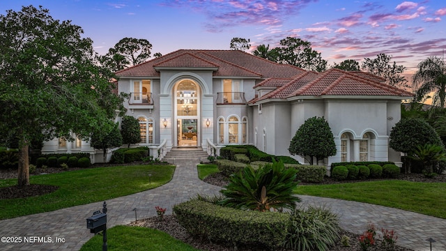 800 Hawks Nest Ct, Ponte Vedra Beach, FL 32082 - mediterranean / spanish-style house featuring stucco siding, a balcony, and a tiled roof