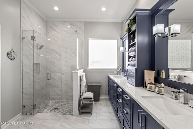 bathroom featuring a sink, double vanity, a stall shower, and crown molding