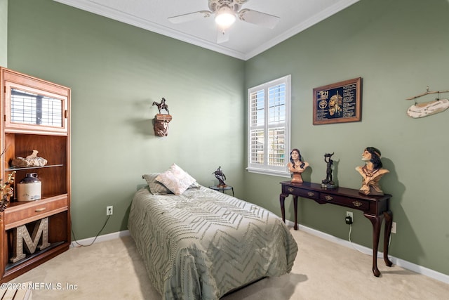 carpeted bedroom featuring crown molding, multiple windows, a ceiling fan, and baseboards