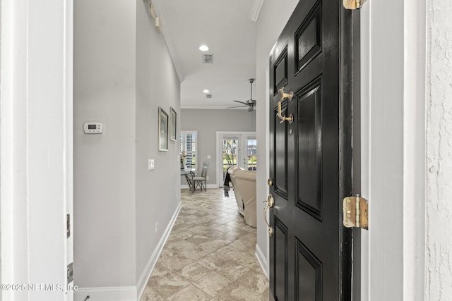 hallway with recessed lighting, visible vents, baseboards, and crown molding