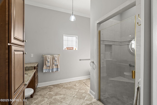 bathroom featuring a shower stall, vanity, crown molding, and baseboards