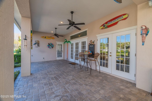 view of patio / terrace featuring french doors and ceiling fan