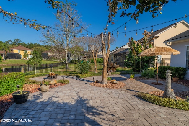 surrounding community featuring a patio and fence