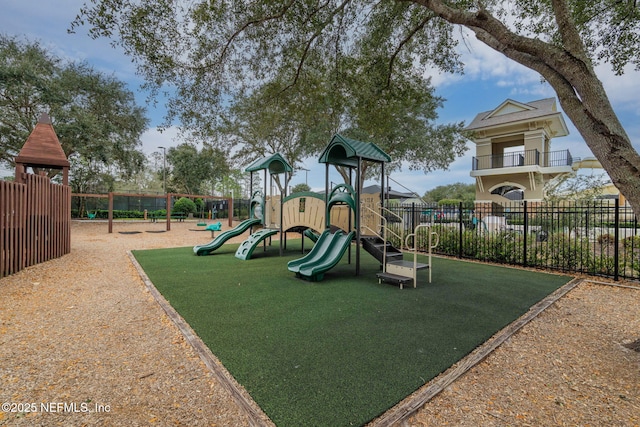 community jungle gym featuring fence