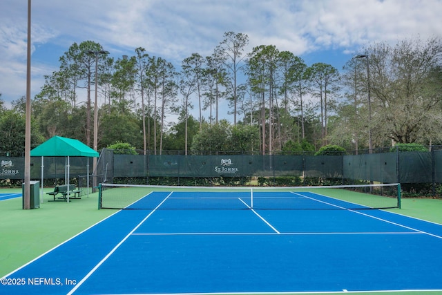 view of sport court featuring community basketball court and fence