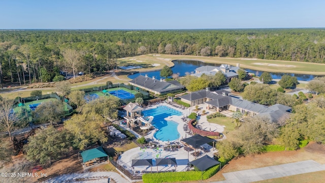 drone / aerial view with a view of trees and a water view