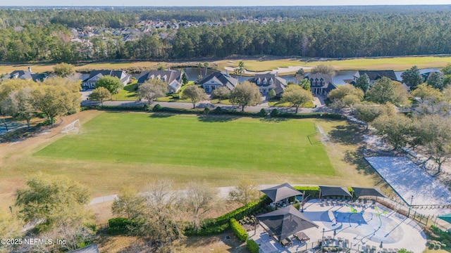 bird's eye view with a wooded view and a residential view