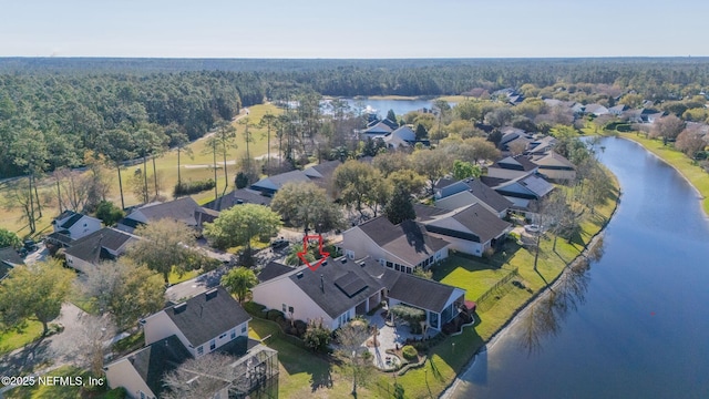 drone / aerial view with a residential view and a water view