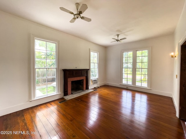 417 N 3rd St, Palatka, FL 32177 - unfurnished living room with ceiling fan, dark wood finished floors, baseboards, and a brick fireplace