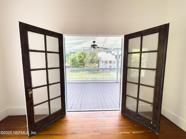 417 N 3rd St, Palatka, FL 32177 - doorway featuring wood-type flooring, ceiling fan, and baseboards