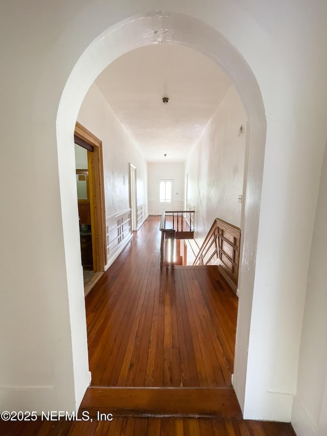 417 N 3rd St, Palatka, FL 32177 - hallway featuring an upstairs landing, arched walkways, and wood-type flooring