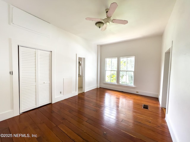 417 N 3rd St, Palatka, FL 32177 - unfurnished bedroom featuring wood-type flooring, a closet, baseboards, and ceiling fan