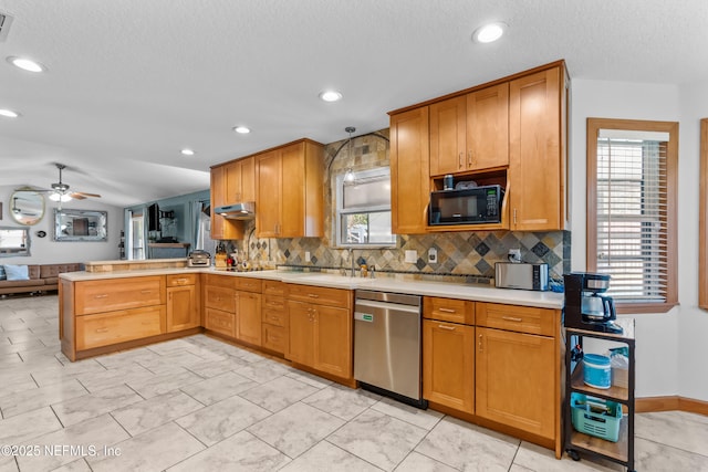 kitchen with a peninsula, decorative backsplash, light countertops, black microwave, and stainless steel dishwasher