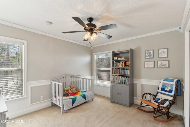 bedroom with light colored carpet, a textured ceiling, and crown molding