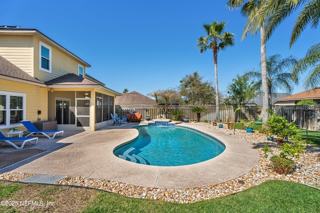 view of swimming pool featuring a fenced in pool, a patio, a fenced backyard, and a sunroom