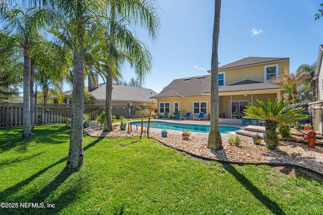 view of pool featuring a fenced backyard, a patio area, a fenced in pool, and a yard