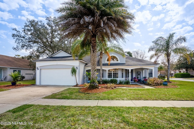 view of front of house featuring driveway, an attached garage, covered porch, stucco siding, and a front lawn