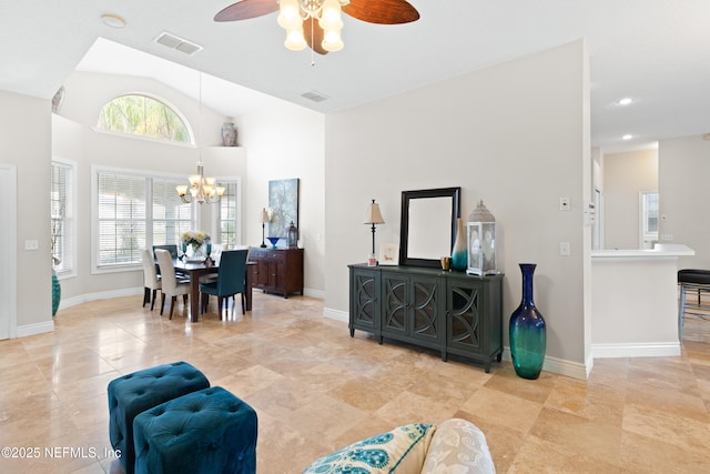 tiled living area featuring recessed lighting, visible vents, baseboards, and ceiling fan with notable chandelier