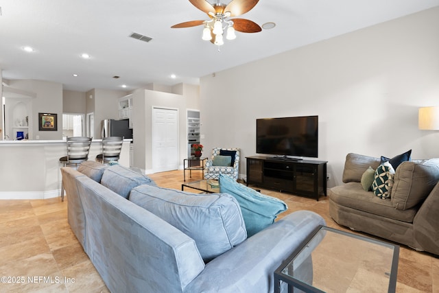 living room with recessed lighting, visible vents, baseboards, and a ceiling fan