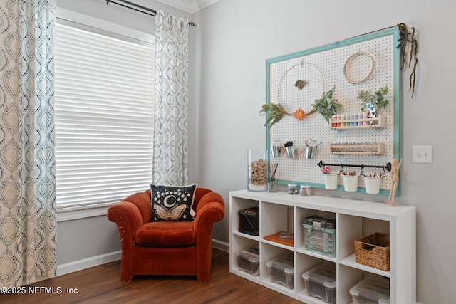 living area with wood finished floors and baseboards