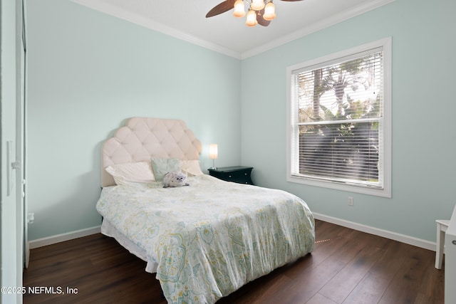 bedroom with ceiling fan, baseboards, dark wood-type flooring, and ornamental molding