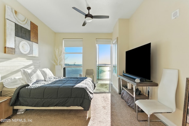 bedroom featuring carpet, baseboards, and ceiling fan