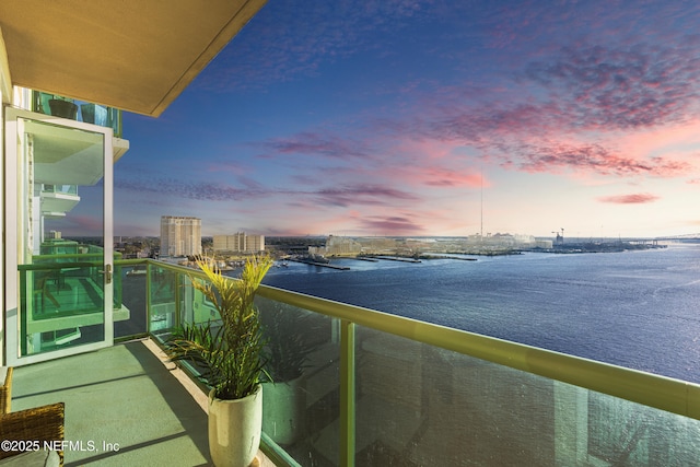 balcony at dusk with a water view