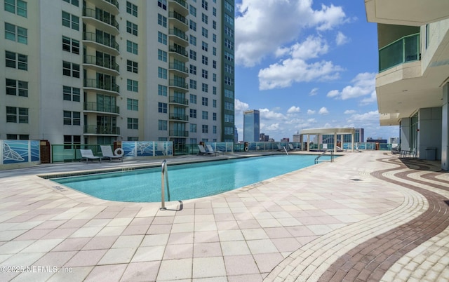 pool featuring a patio and a view of city