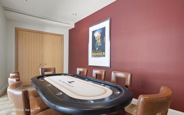 game room featuring baseboards and wood finished floors