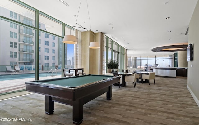 playroom featuring pool table, floor to ceiling windows, baseboards, and a wealth of natural light