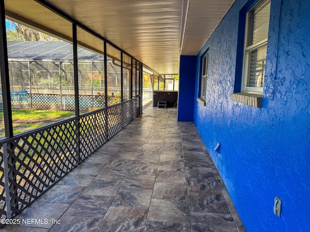 view of patio / terrace featuring a lanai and a pool