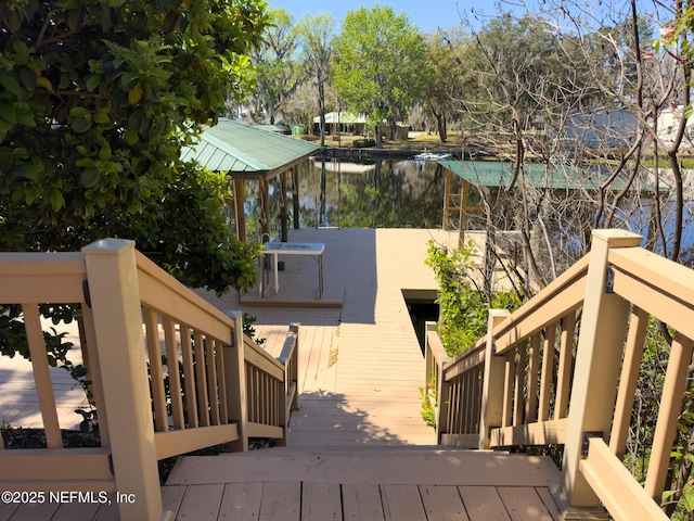 wooden deck featuring a water view