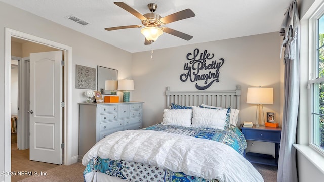 bedroom with visible vents and a ceiling fan