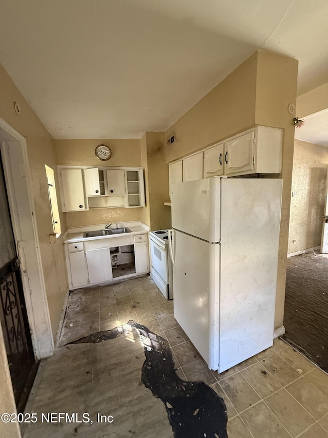 kitchen with open shelves, a sink, white appliances, white cabinets, and light countertops