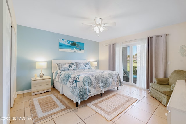 tiled bedroom with access to outside and ceiling fan