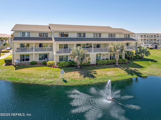 view of property with a water view