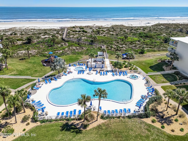 aerial view with a water view and a view of the beach