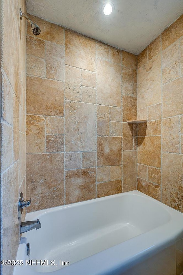 bathroom with recessed lighting and tub / shower combination