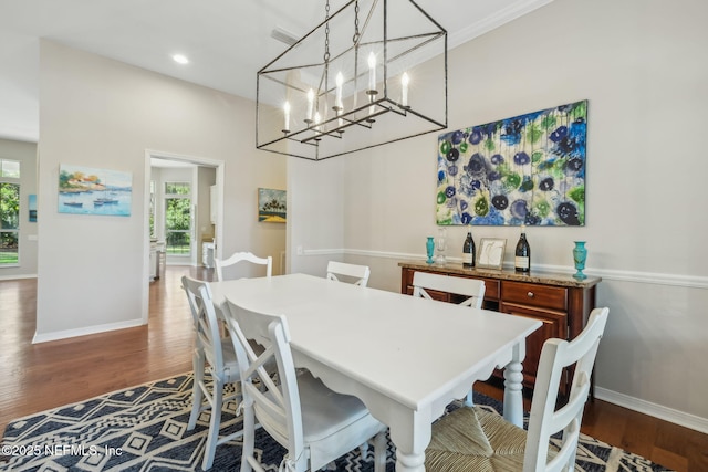 dining space with dark wood-type flooring, recessed lighting, and baseboards