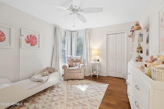 bedroom with wood finished floors, a closet, and ceiling fan