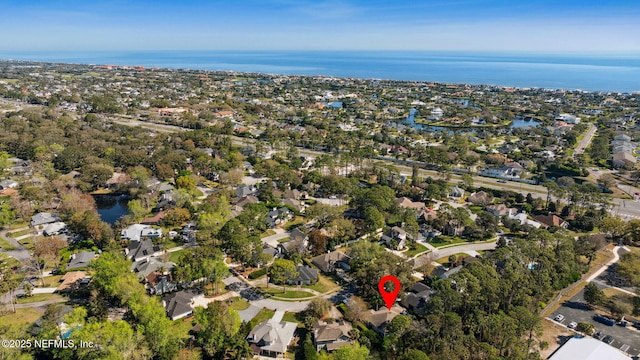 bird's eye view featuring a water view and a residential view