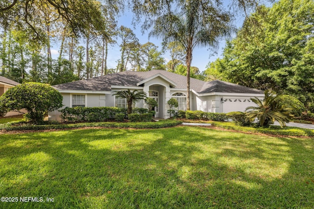 ranch-style house featuring a front yard, stucco siding, roof with shingles, concrete driveway, and an attached garage